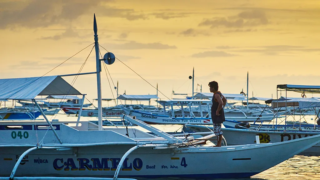 Boats of Alona beach, Bohol Island, Philippines. A must-see destination in the Philippines.