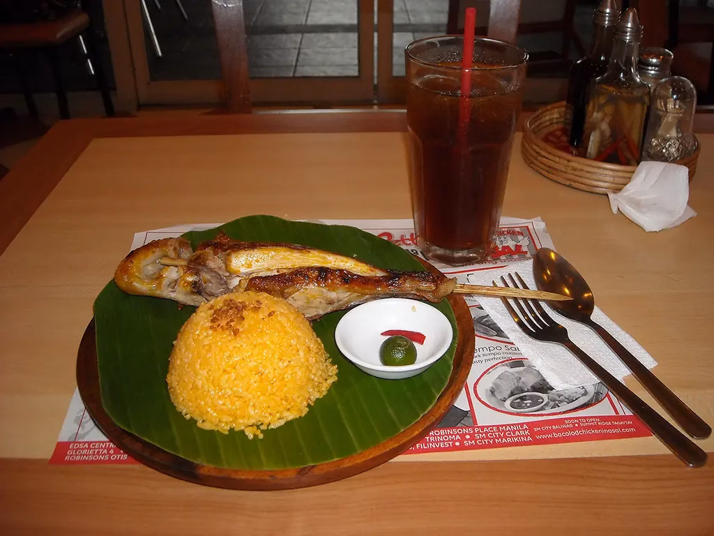 This is another very popular example of Filipino cuisine. This is showing a Chicken Inasal meal in Bacolod.