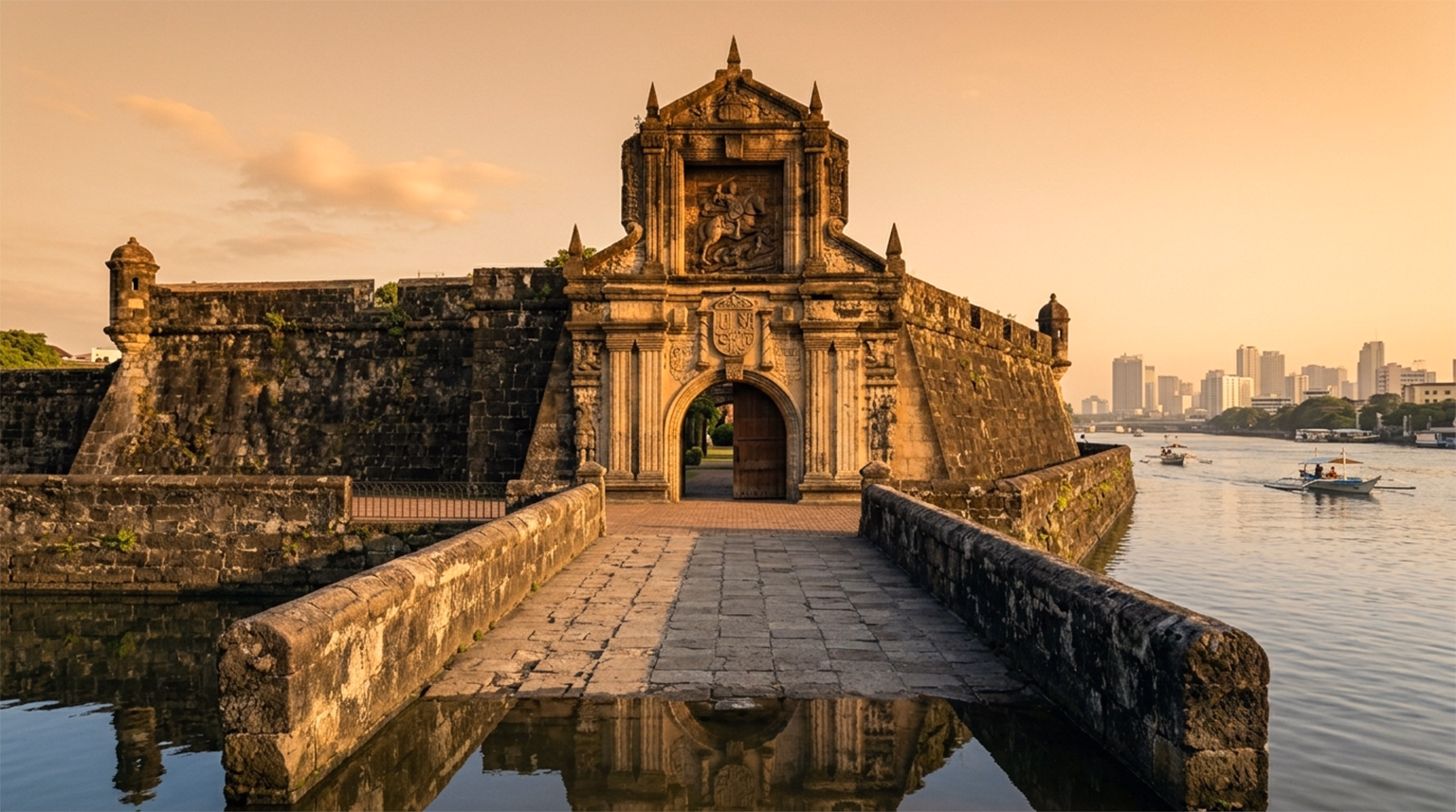 Fort Santiago main gate stone arch and bridge over moat Intramuros Manila Philippines