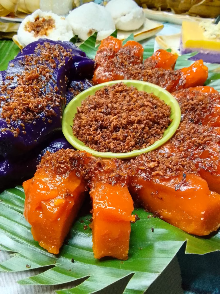 Bohol's kalamay, a sweet sticky rice dessert, typically served in a traditional coconut shell container.