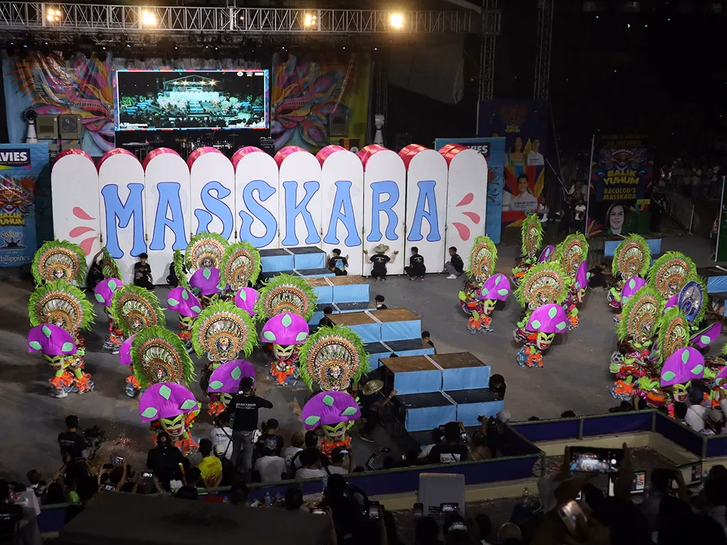 A picture of the Masskara 2022 Arena Dance. It provides some indication of the elaborate costumes on display.