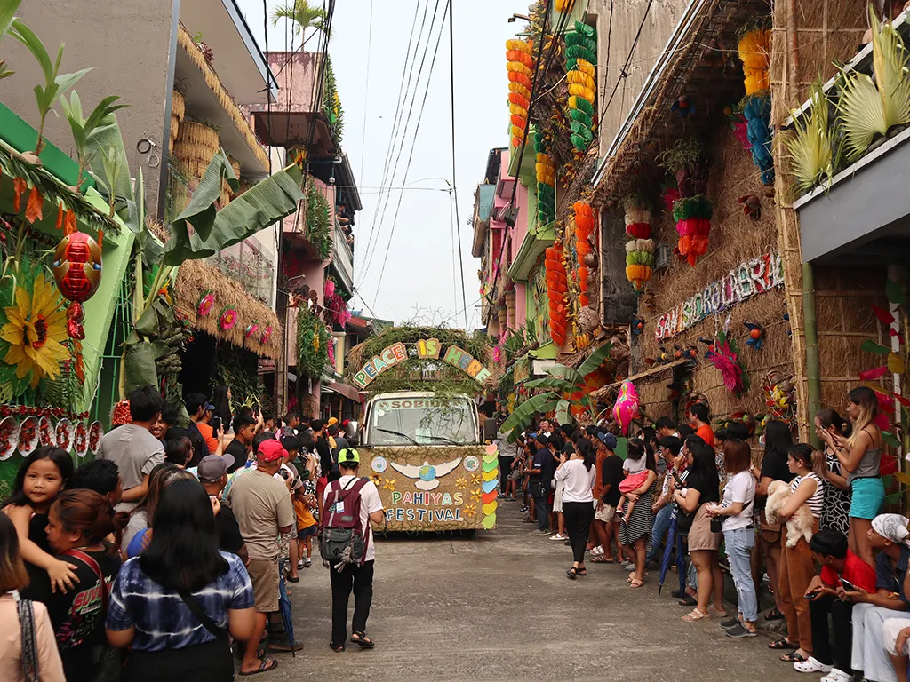 This picture shows the elaborate decorations applied to the buildings during the Pahiyas Festival to show their appreciation for their agricultural bounties.