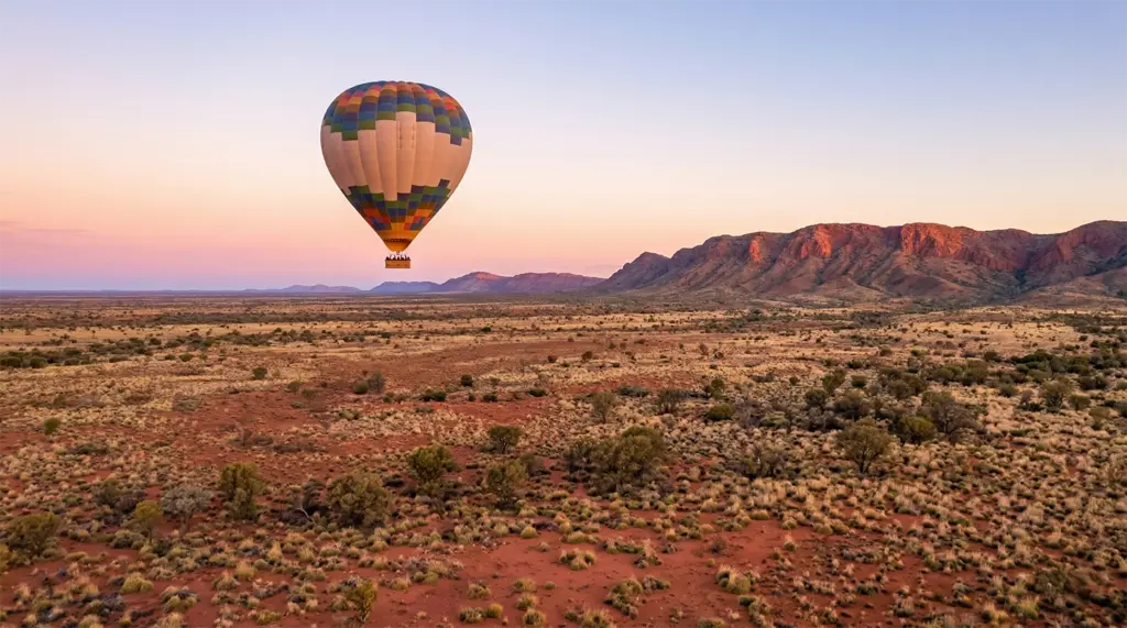 Hot air balloon at dawn, Red Centre desert, Alice Springs, Northern Territory, Australia, sunrise