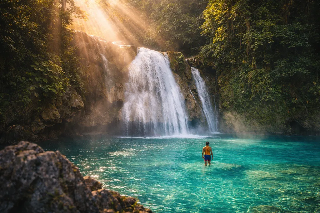 Kawasan Falls turquoise blue water cascade Cebu Philippines tropical waterfall photography