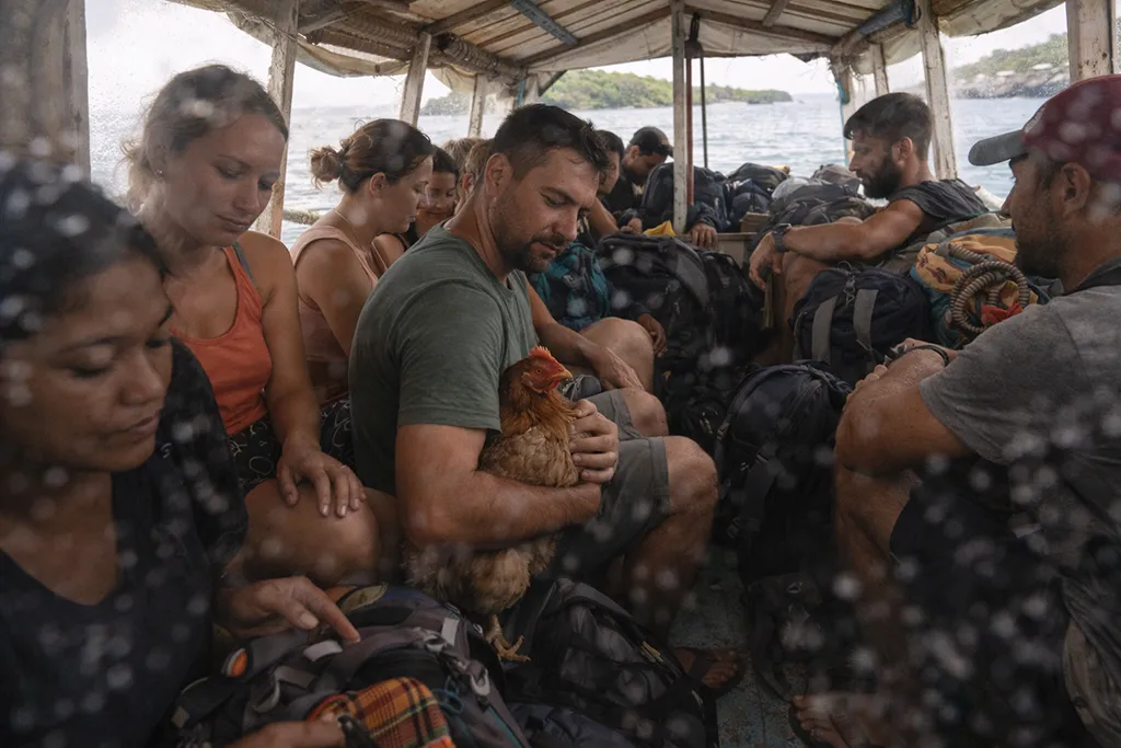 Crowded bangka boat from Maya Port to Malapascua Island with backpackers and local passengers