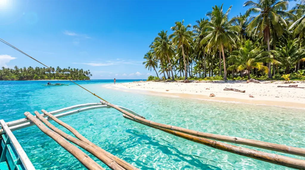 Tri-island tour outrigger boat passing small island sandbars, Siargao, Philippines, turquoise water